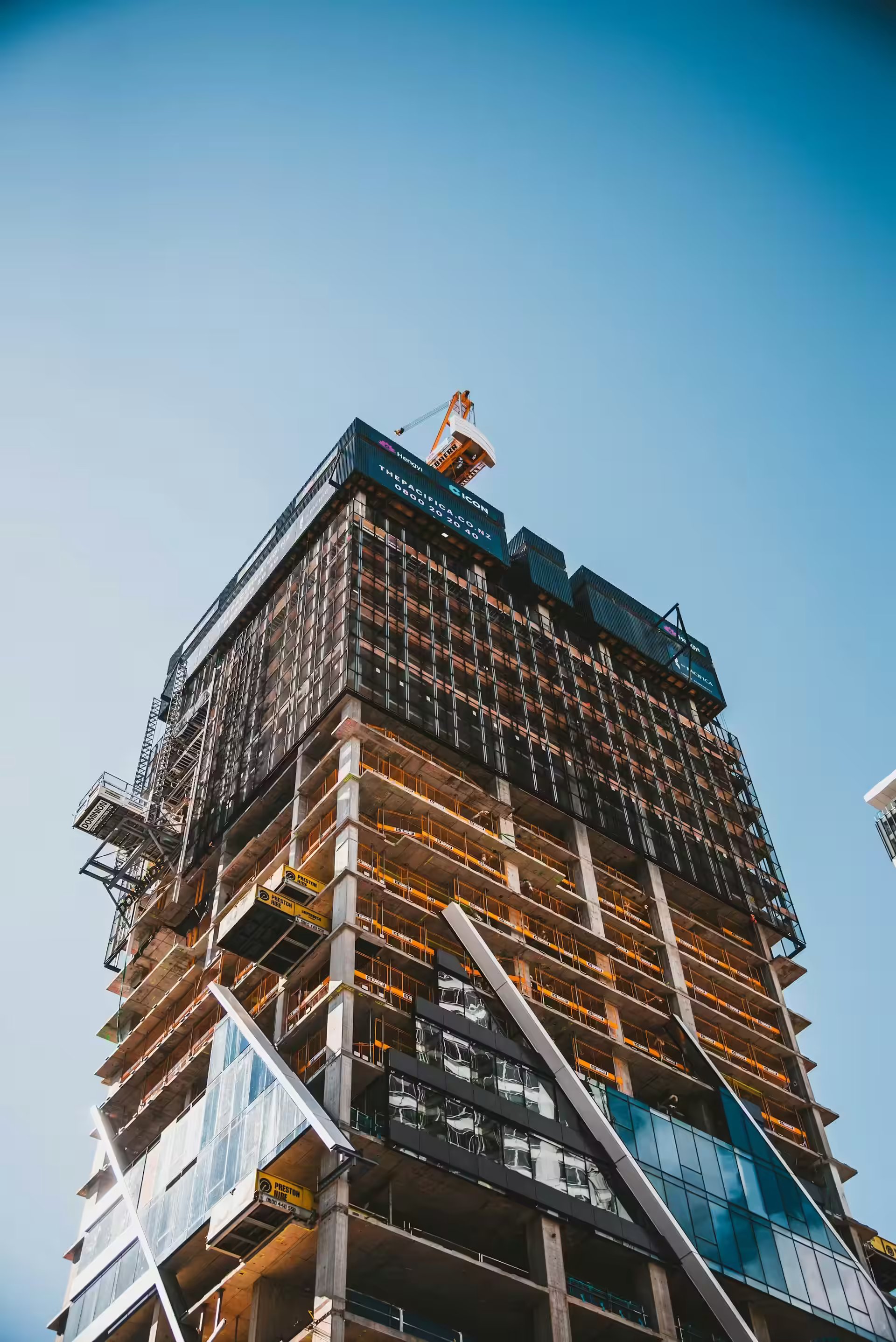 Brown and gray building under construction